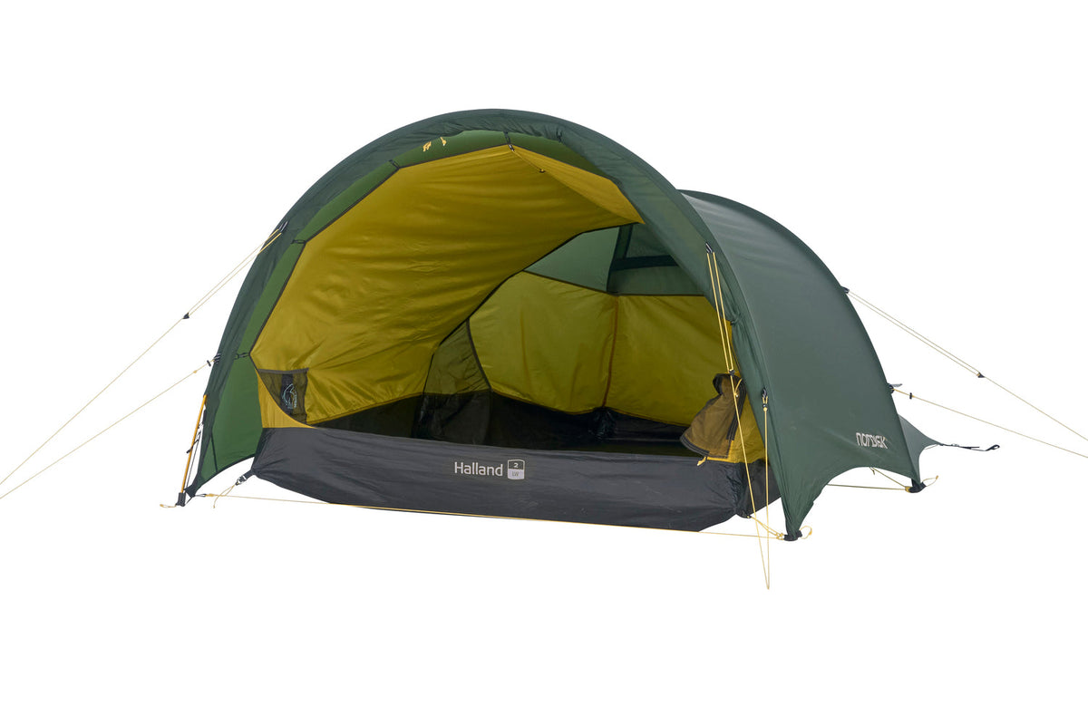 Green and yellow tent with 'Nordisk' branding on a white background