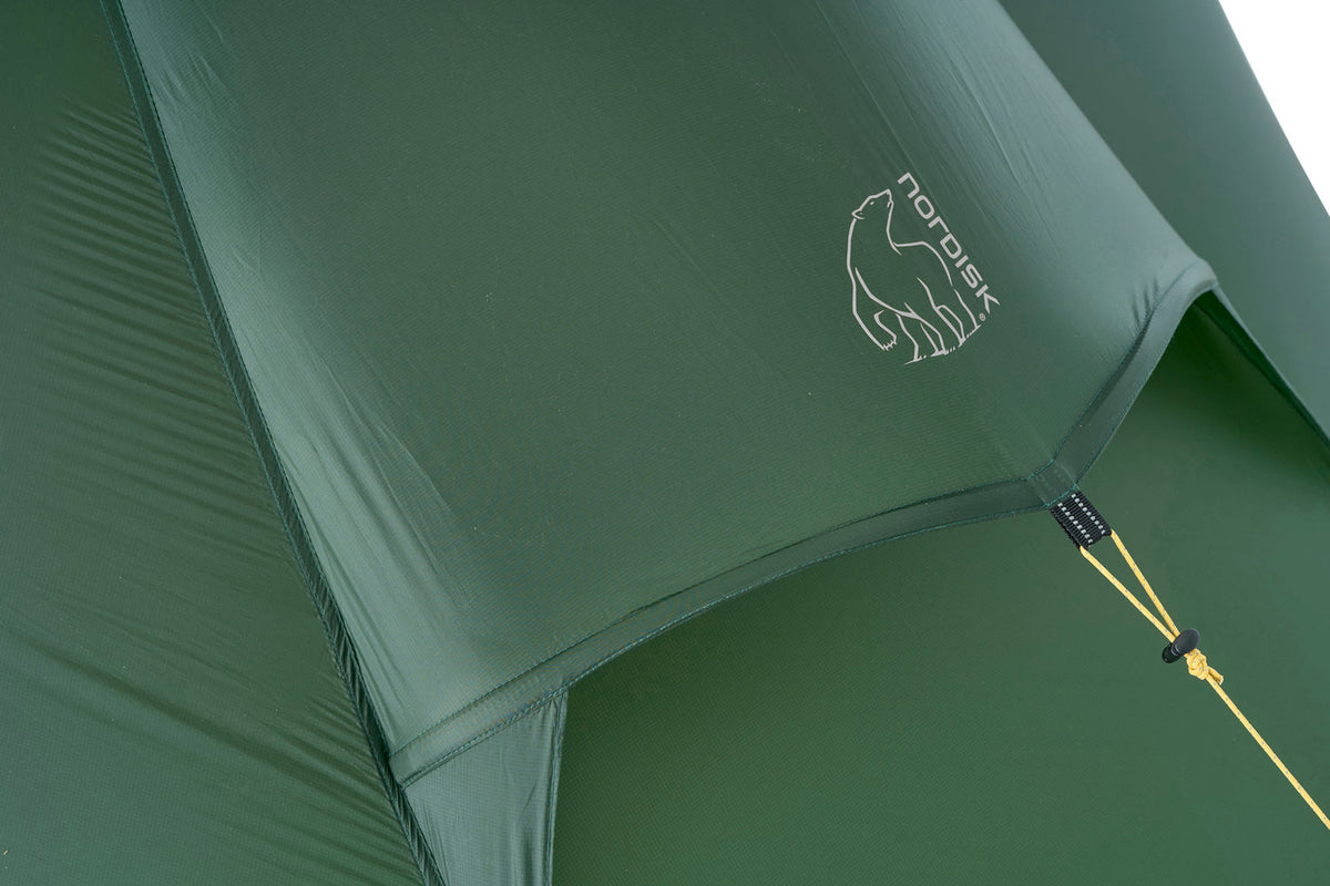 Green tent with a brand logo on a white background