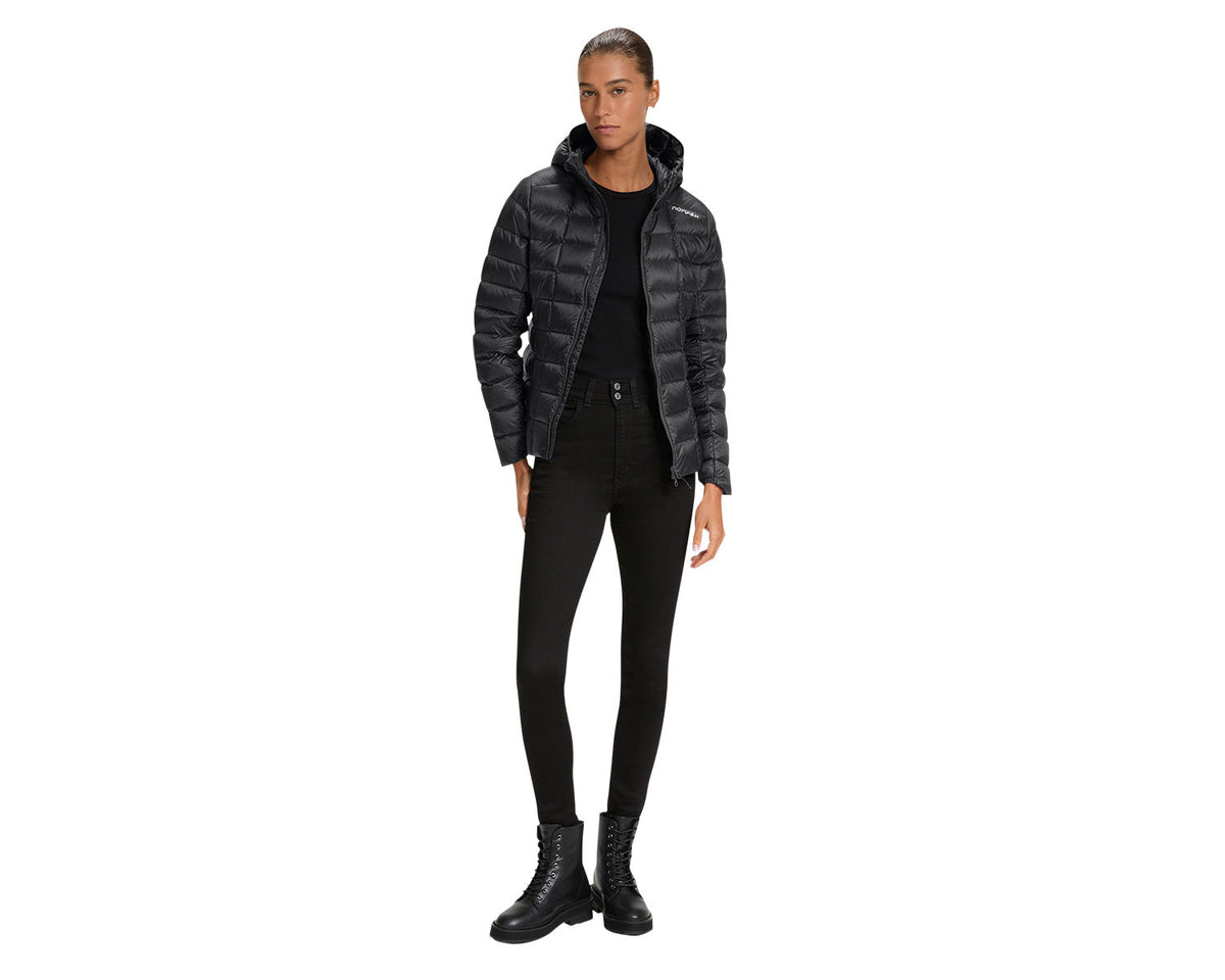 Person wearing a black and gray puffer jacket on a white background
