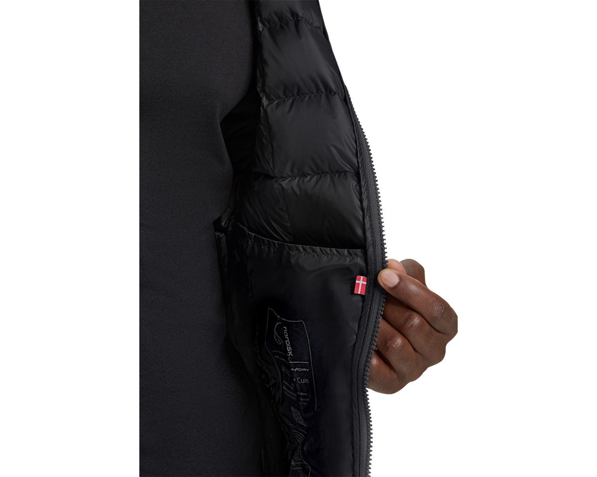 Close-up of a black jacket with a brand logo on a white background