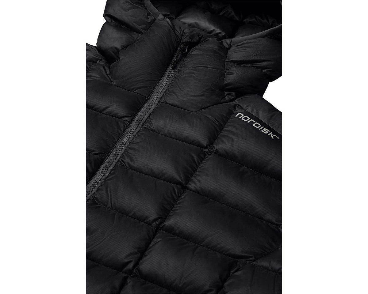 Close-up of a black puffer jacket with 'nordisk' branding on a white background