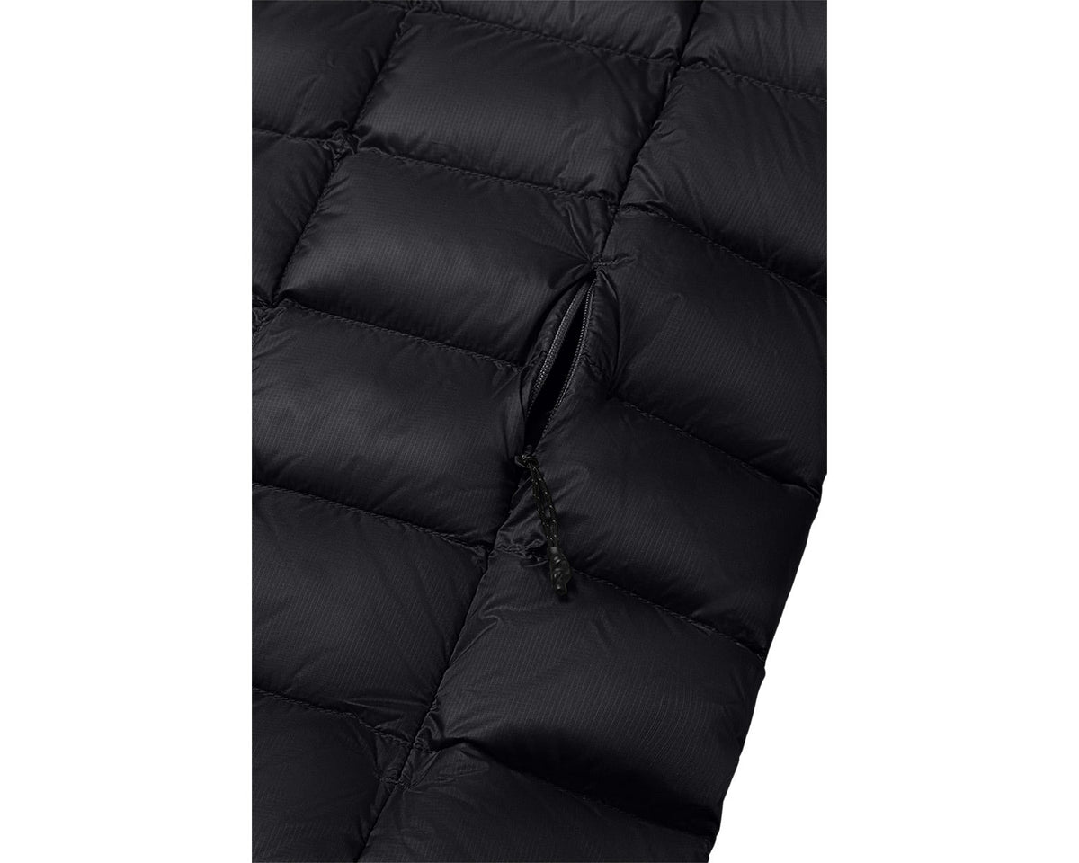 Close-up of a black puffer jacket with quilted texture on a white background