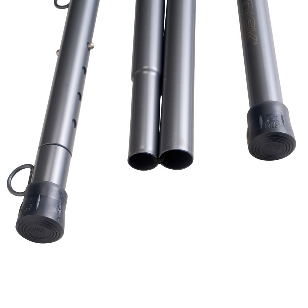 Close-up of three dark gray metal pole sections with black plastic end caps and a small loop, shown on a plain white background. One section has gold branding text that appears to read 'NORDISK'.